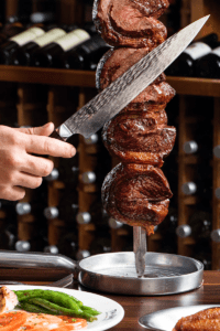 slicing meat on the skewer