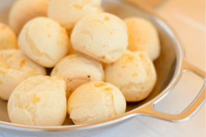 A plate of Brazilian Cheese Bread laid out at the diner table