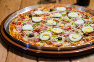 Brazilian style pizza with boiled egg and ham