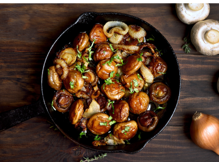 burgundy mushrooms in a black castiron skillet