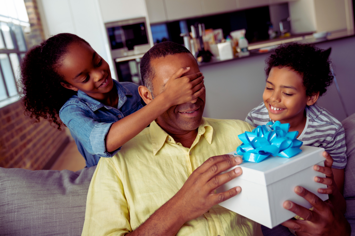 kids surprising Dad with gifts for Father's Day