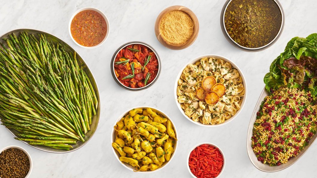 texas de brazil salad area menu with various foods in bowls and on plates